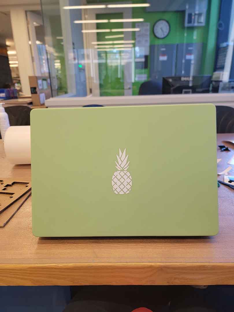laptop with pineapple sticker